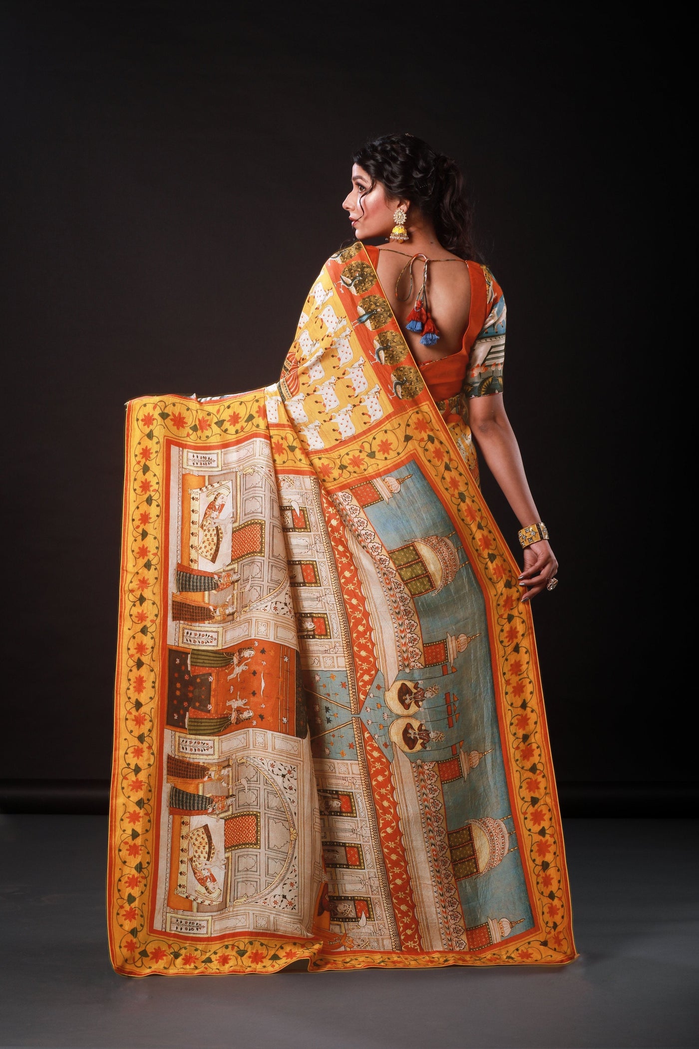 Monumental Orange Artwork Satin Print Saree